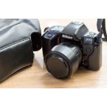 A Nikon F70 SLR camera, cased, working order, and a Nikon Nikkormat SLR camera,
