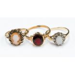 Three 9ct gold dress rings comprising a garnet set, a cameo and an opal and diamond approx 6.