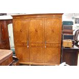 An Edwardian satinwood veneered triple sectioned wardrobe Please note: this lot matches lot 2165