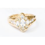 A 9ct gold cluster ring set with moonstones, size Q, gross total weight 3.