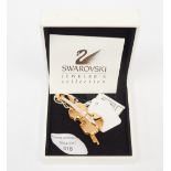 A Swarovski bar brooch, in the form of a Violin with cut glass insets,