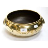 An Oriental bronze bowl, squat ovoid form with applied fan motifs,