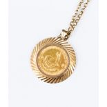 A 1/10 Krugerrand in 9ct mount and chain, 9.