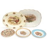 A collection of pheasant plates, including meat plates and a Royal Crown Derby 7.