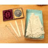 A lace oval edging piece with bone items and a cased daguerreotype picture (one box)