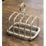 A George V silver four tier toast rack, Birmingham 1923, makers mark for S.W.