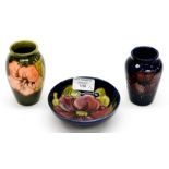 Two Moorcroft vases, with a trinket dish,