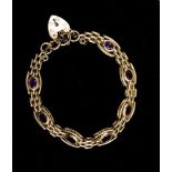 An amethyst set 9ct gold bracelet with padlock fastener, gross weight approx 18.