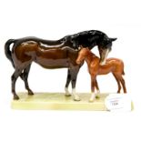 A Beswick mare and fola on ceramic stand