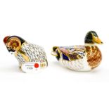 Two Royal Crown Derby paperweights comprising 'Derby Ram' and a 'Duck', one with box,