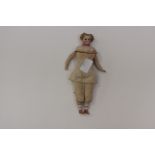 A mid 19th Century small head and shoulders doll, possibly German with stuffed linen body,