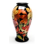 A Moorcroft Trail vase, designed and signed Emma Bossons, Day Lillies on black ground,