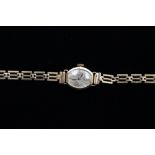 A ladies vintage 14ct gold watch on a 9ct gold bracelet