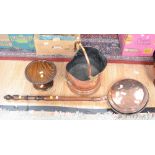 A copper coal scuttle; warming pan;
