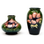 A squat Moorcroft vase and a small baluster vase,
