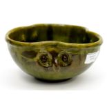 An art pottery bowl, three moulded owl faces, possibly Farncombe.