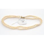 A two row cultured pearl necklace with a 9ct gold clasp