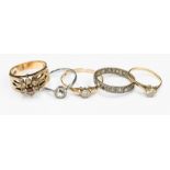 Five 9ct gold and white metal rings, three set with clear stones,