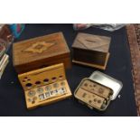 A box of weights with a tin of weights, an inlaid sewing box,