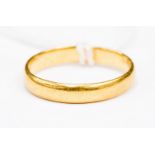 A 22ct gold band approx 3mm wide, size N1/2 total weight approx 3.