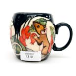 A Moorcroft mug in the Tfor pattern (Mouse eating Rose Hips) standing approx 9 cm high