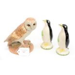 A Royal Doulton barn owl along with two Carlton Ware style penguins