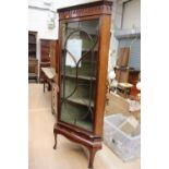 An Edwardian single door glazed display cabinet,