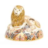 A boxed Royal Crown Derby Lion paperweight,
