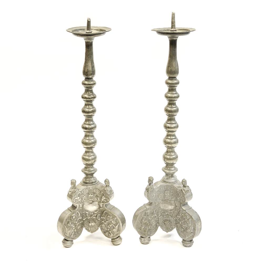 A pair of 19th Century German pewter pricket candlesticks with maker's and town marks struck on the