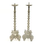 A pair of 19th Century German pewter pricket candlesticks with maker's and town marks struck on the