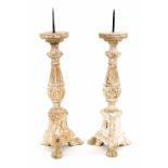 A pair of Spanish style carved wood pricket sticks,