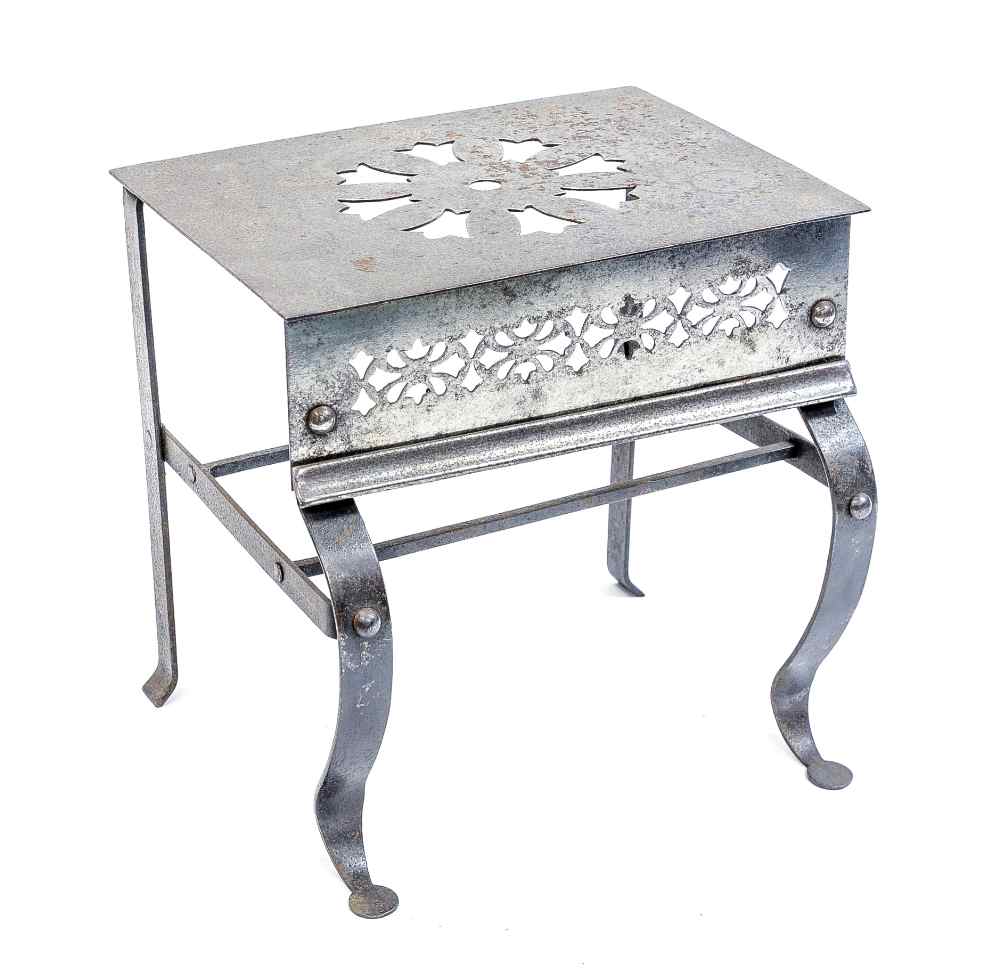 A 19th century polished steel fire trivet,