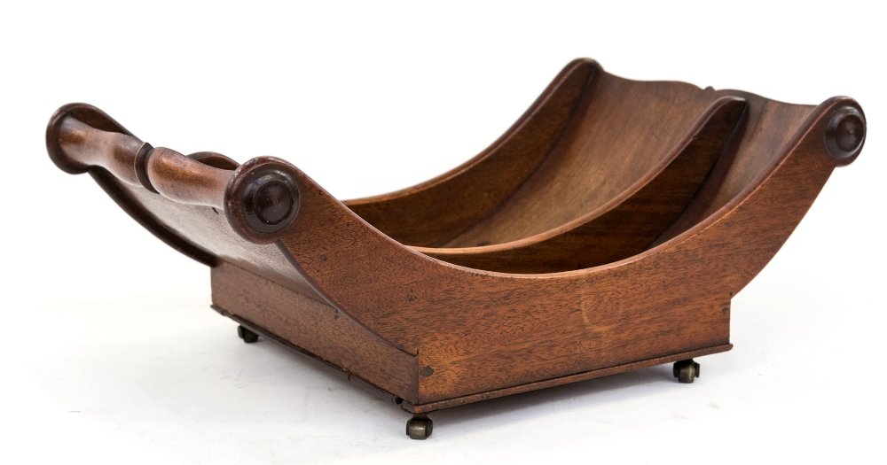 A George III mahogany cheese trough, circa 1815, on brass caster feet, twin section boat form,