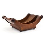 A George III mahogany cheese trough, circa 1815, on brass caster feet, twin section boat form,