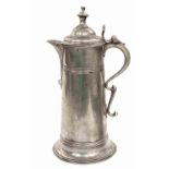 A tall spouted pewter spire flagon made in London in the early 19th Century,