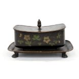 An early 19th century Toleware box and cover on integrated tray,