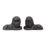 A pair of 19th century cast iron figures of recumbent Lions,