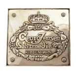 Georg Jensen, a Danish silver plate advertising plaque, Copenhagen ,