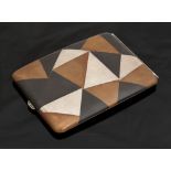 A Japanese silver and copper cigarette case, geometric design of oxidised silver,