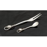 Georg Jensen, a Danish silver Blossom pattern salt spoon and pickle fork, designed 1919, number 84,