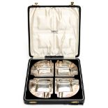 A boxed set of four Art Deco silver ashtrays, Birmingham 1937, A. Bros.