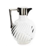 An Aesthetic Movement silver mounted glass claret jug, after Christopher Dresser,