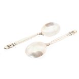 Johan Rohde for Georg Jensen, a pair of Danish silver Acorn or Konge pattern preserve spoons,