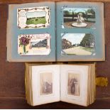 Two photograph and postcard albums to include Victorian photos of dwarfs,