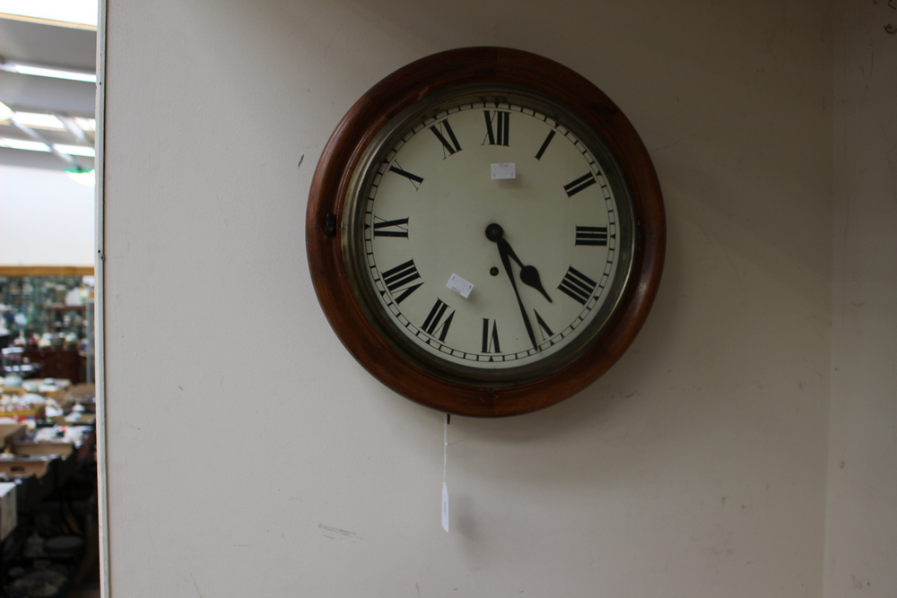 A 19th century mahogany wall clock with a circular dial,