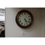 A 19th century mahogany wall clock with a circular dial,