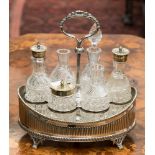 An Elkington six piece silver plated cruet stand complete with six bottles (two stoppers missing)