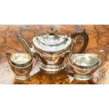 A silver three piece tea service; teapot, cream and sugar, Birmingham 1924, Henry Matthews,