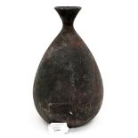 An early 20th Century high fired red stoneware bottle vase 96.29 inscribed and the initials P.C.