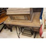 A late 19th Century table treadle sewing machine,